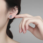 Trilogy Cluster Studs — VVS Moissanite